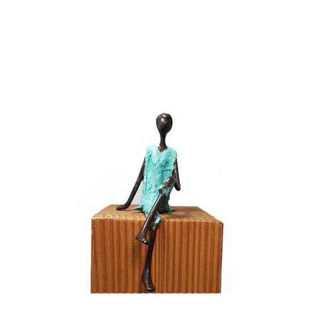 Zittende man turquoise